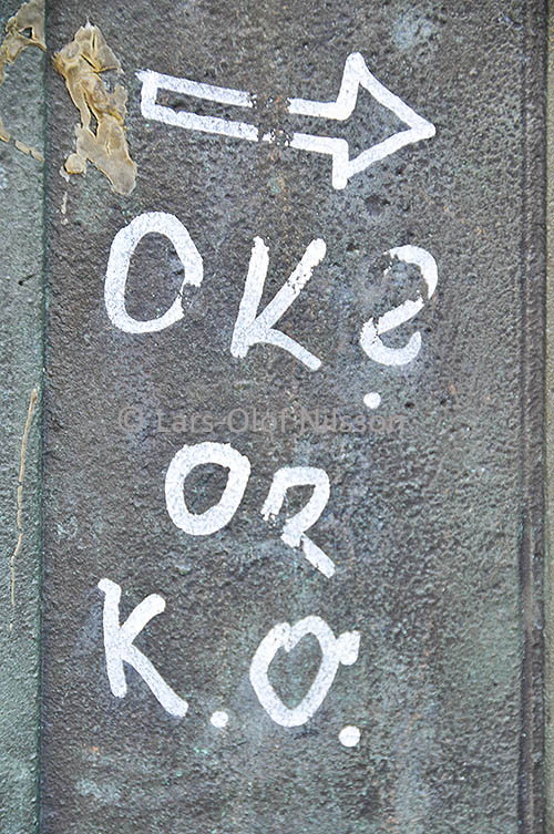 Graffiti showing the abbreviations OK and K.O.