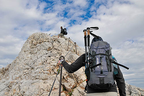 Two adults hiking in the Julian Alps in Slovenia on their way to the highest peak, Triglav.