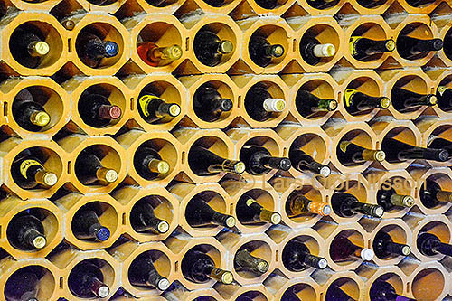 Terra-cotta wine racks with bottles