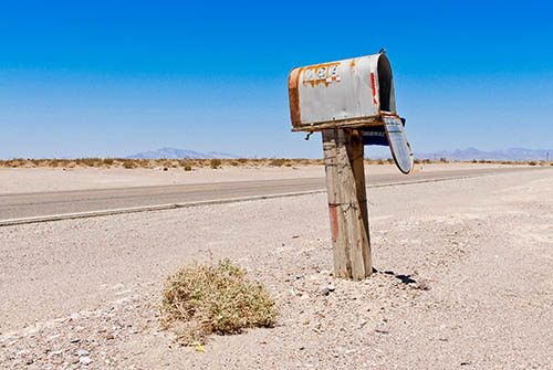 Battered letterbox by the roadside in the US desert