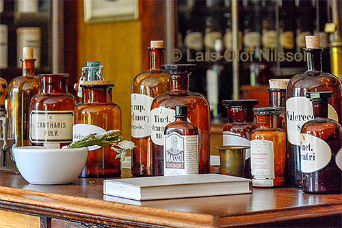 Interior of a pharmacy with bottles of medicine.