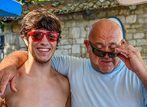 A young man and a middle-aged man wearing different models of sunglasses. The image illustrates the difference between different and various.