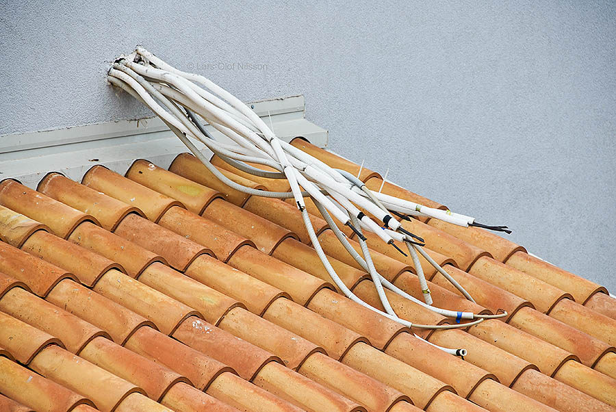 Several cables sticking out from a wall, all with loose ends. The image is intended to illustrate email problems resulting in no contact.